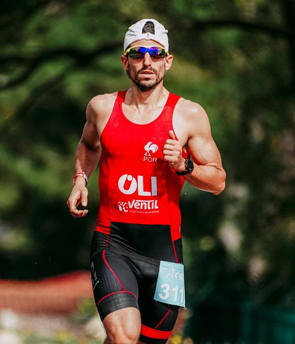 Confident man performing a strength exercise in a bright room.